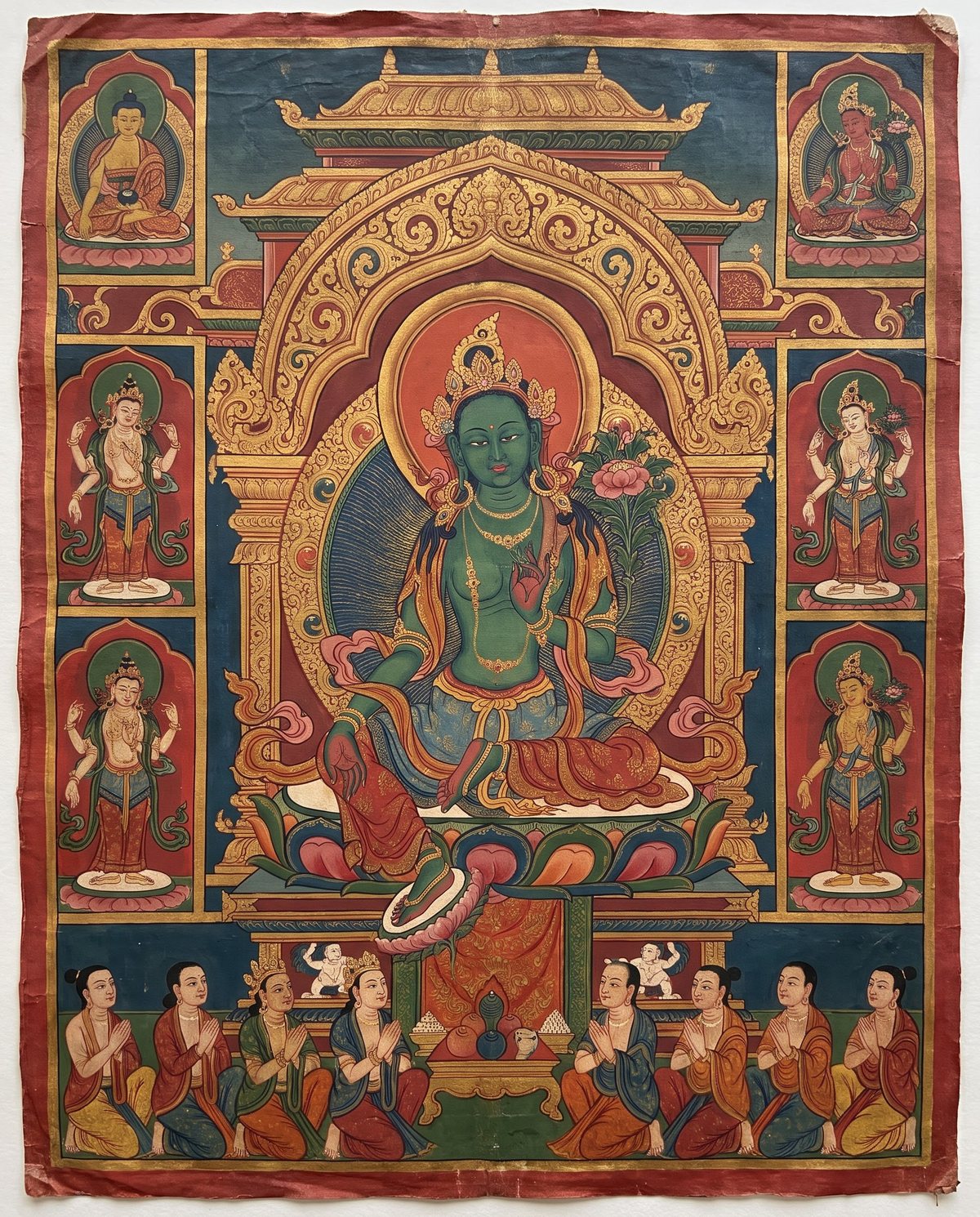 AI design illustration of Green Tara seated on a lotus beneath a gilded arch; not a catalogued artwork.